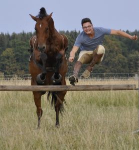Image of Carl and Pegasus jumping the Cavallo Trek Hoof Boot.