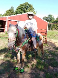 Kathy Deaton on her horse, Tucker