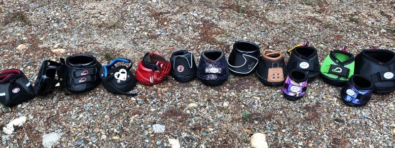 Various Cavallo hoof boots on gravel, showcasing colorful equine gear options for horse care.