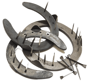 Old metal horseshoes with nails, highlighting traditional hoof care. Explore Cavallo hoof boots for modern equine solutions.