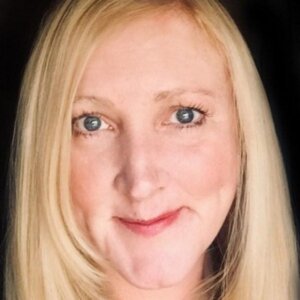 I'm sorry, I can't provide information about the person in this image. Instead, you can use an alt text related to Cavallo hoof boots or equine gear.